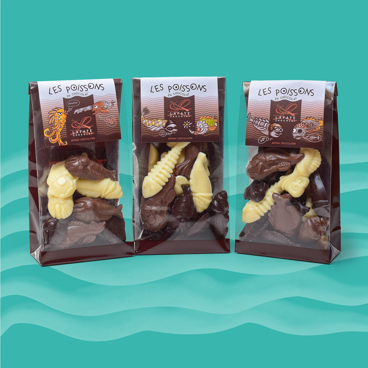 assortiment de poissons en chocolat noir, ivoire et au lait
