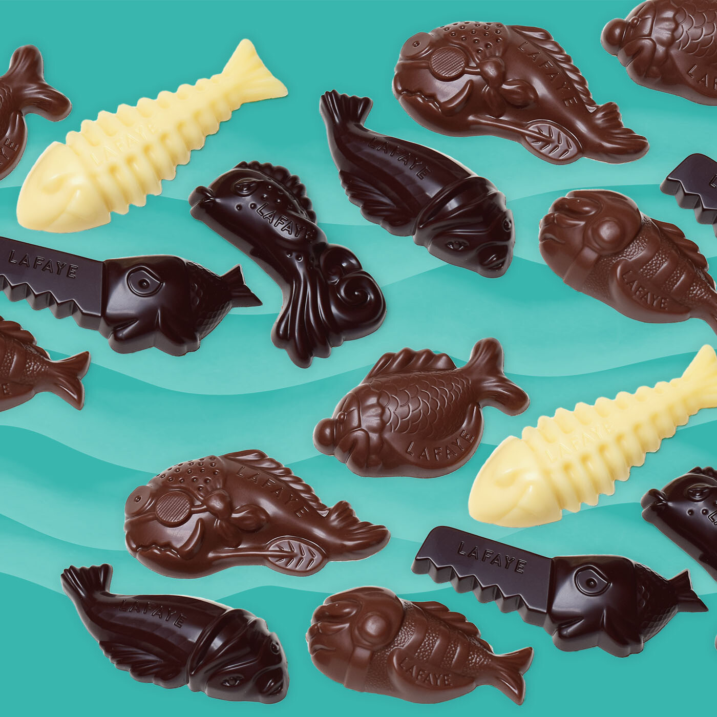 assortiment de poissons en chocolat noir, ivoire et au lait